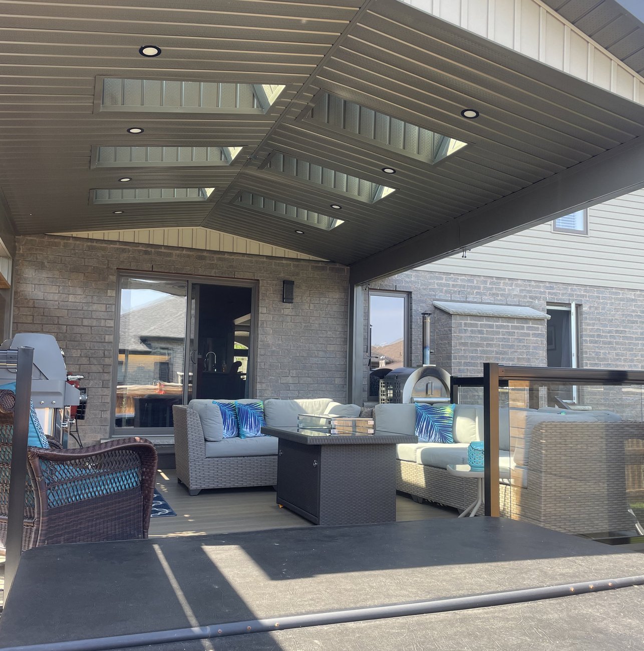 finished covered porch with skylights and composite decking built by Baird Construction in Oxford County