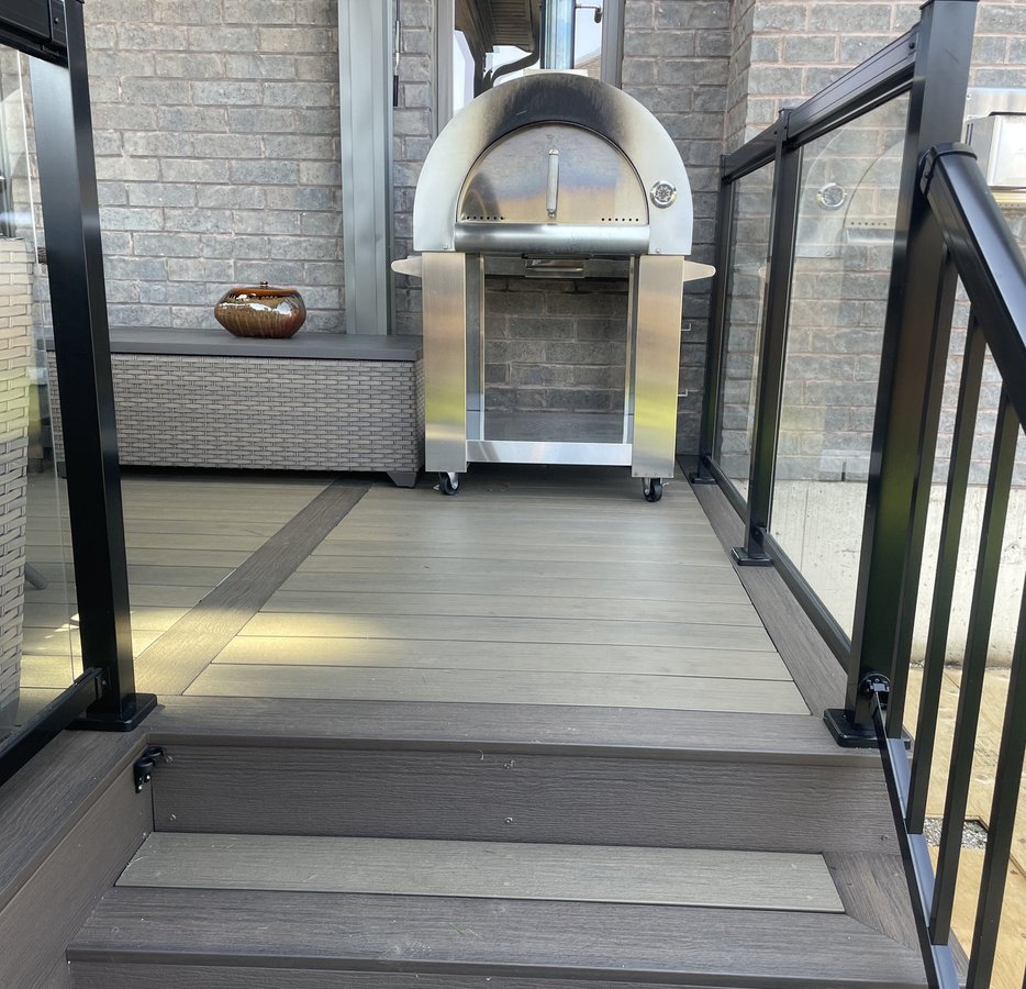 composite deck with glass railing built by Baird Construction in Woodstock ON