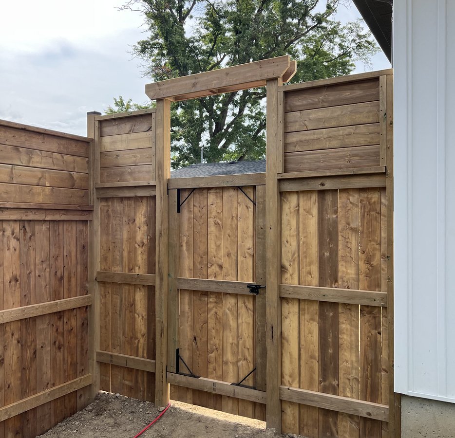 cedar privacy fence and gate with timber arbour built in Woodstock ON