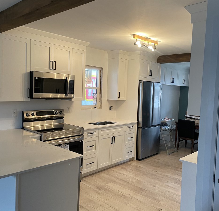 renovated white shaker kitchen with quartz counters in a Woodstock ON home